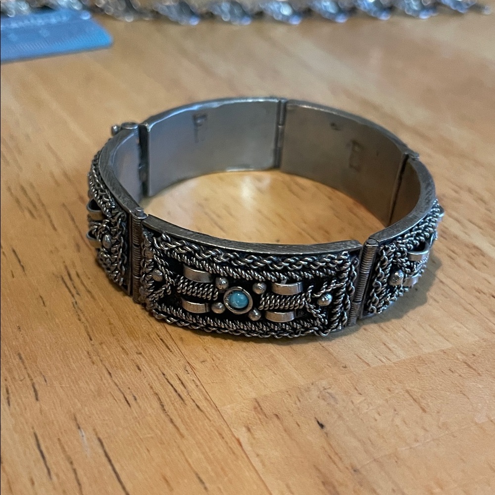 Intricate Silver Bracelet with Turquoise Highlights